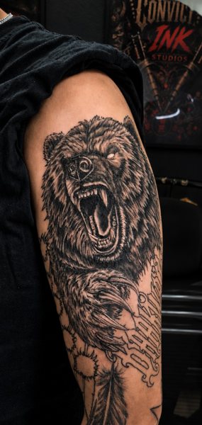 Bear and landscape tattoo