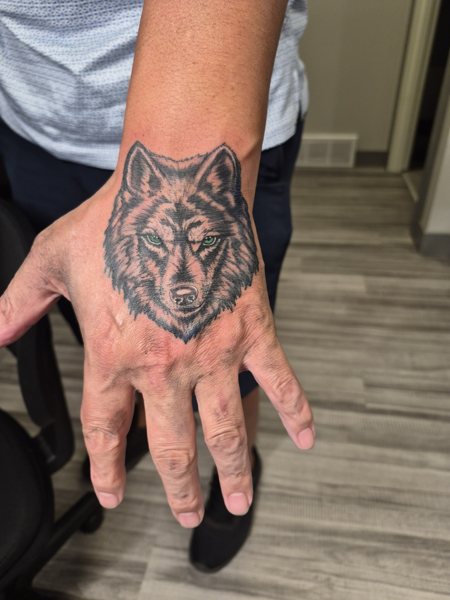 Wolf tattoo on the hand