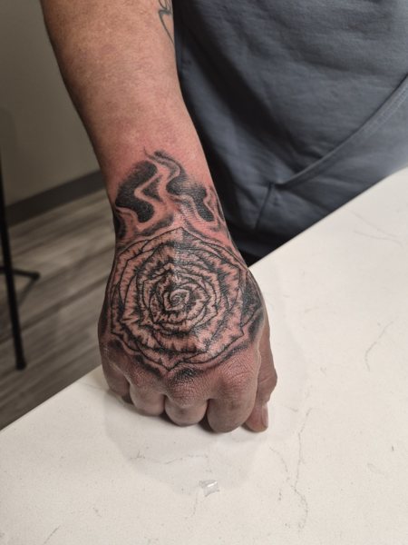 Rose tattoo on the hand
