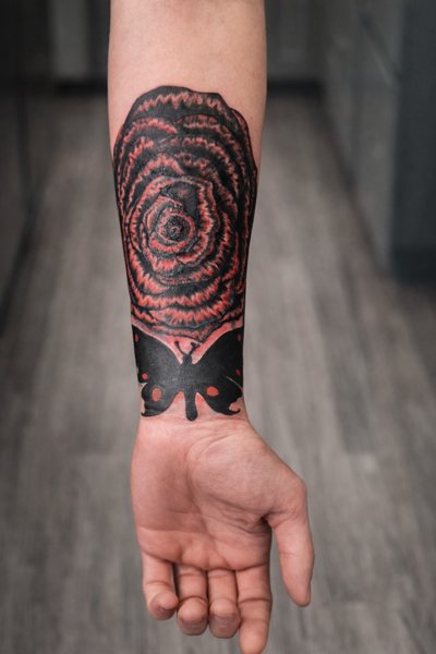 Red and black rose tattoo