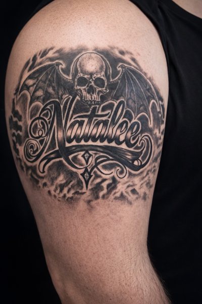 Namesake lettering tattoo